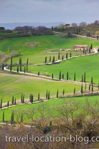 photo of Winding Roads Of The Tuscan Landscape And City Towers